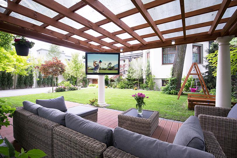 Corner column mounted The TV Shield weatherproof TV enclosure on beautiful detached patio