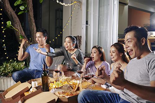 People Watch TV Outside at Outdoor Home Theater System