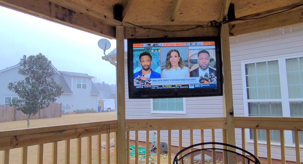 The TV Shield waterproof TV enclosure in rain