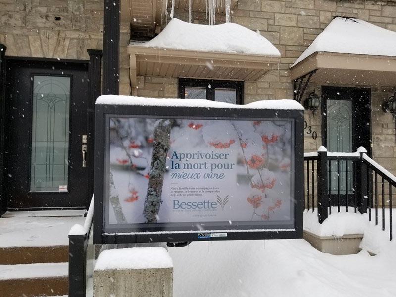 The TV Shield Pro protecting a TV outside in the snow, controlling the climate